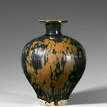 A rust-splashed black-glazed ovoid bottle-vase, Song Dynasty (960–1279)