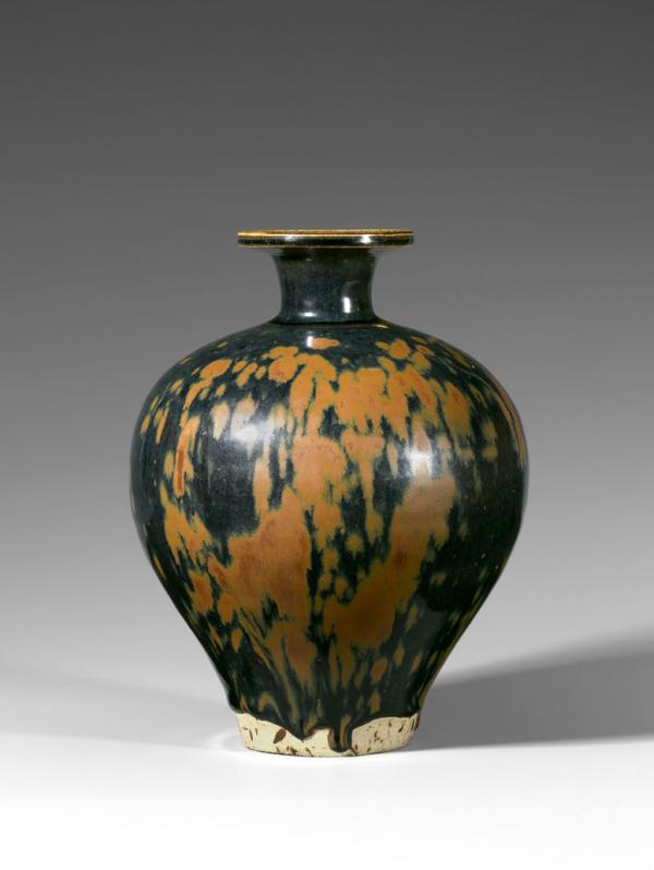 A rust-splashed black-glazed ovoid bottle-vase, Song Dynasty (960–1279)
