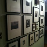Framed photographs on a wall in the St. Louis home of the collecting couple, John and Teenuh Foster.
