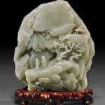 a Qianlong-era (1736–95) jade mountain carving, with a detail of the Chinese inscription on it.