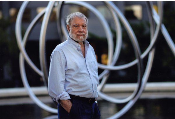 Sculptor Bruce Beasley with Rondo III, 2013, stainless steel, 21.5 feet high.
