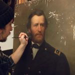Restorer Matt Bergbauer inpainting a portrait of General Ulysses S. Grant