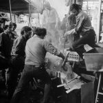 Marvin Lipofsky working on glass with assistants, circa 1970s