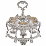 George IV sterling silver egg frame and six parcel-gilt egg cups