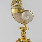 Stand by Johann Joachim Busch, Green turban shell mounted as cup and cover in the form of a basilisk, cup circa 1600
